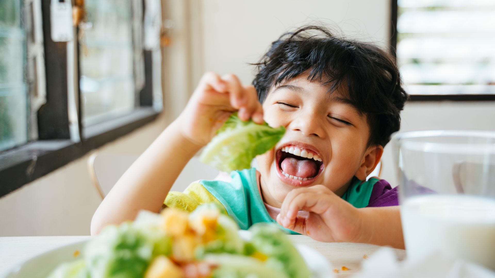A child eating a plant-based diet