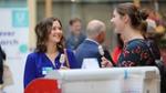 Two student winners eating ice cream during the poster presentation lunch for the Research Prizes.